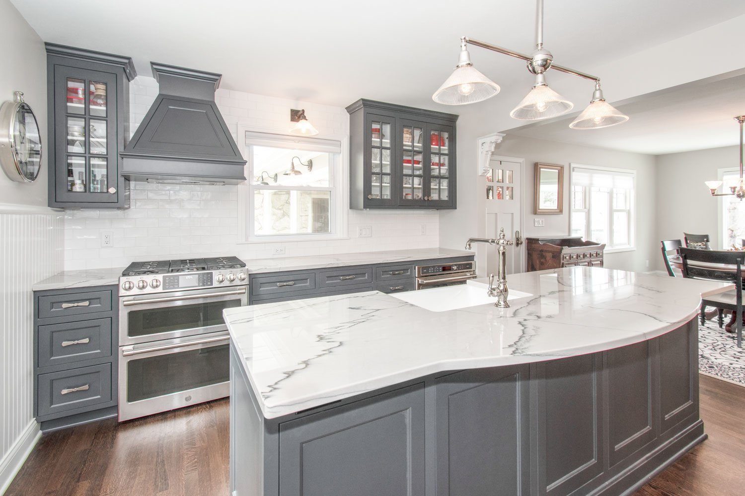 Delafield Kitchen with gray cabinets, quartz counters and white subway tile