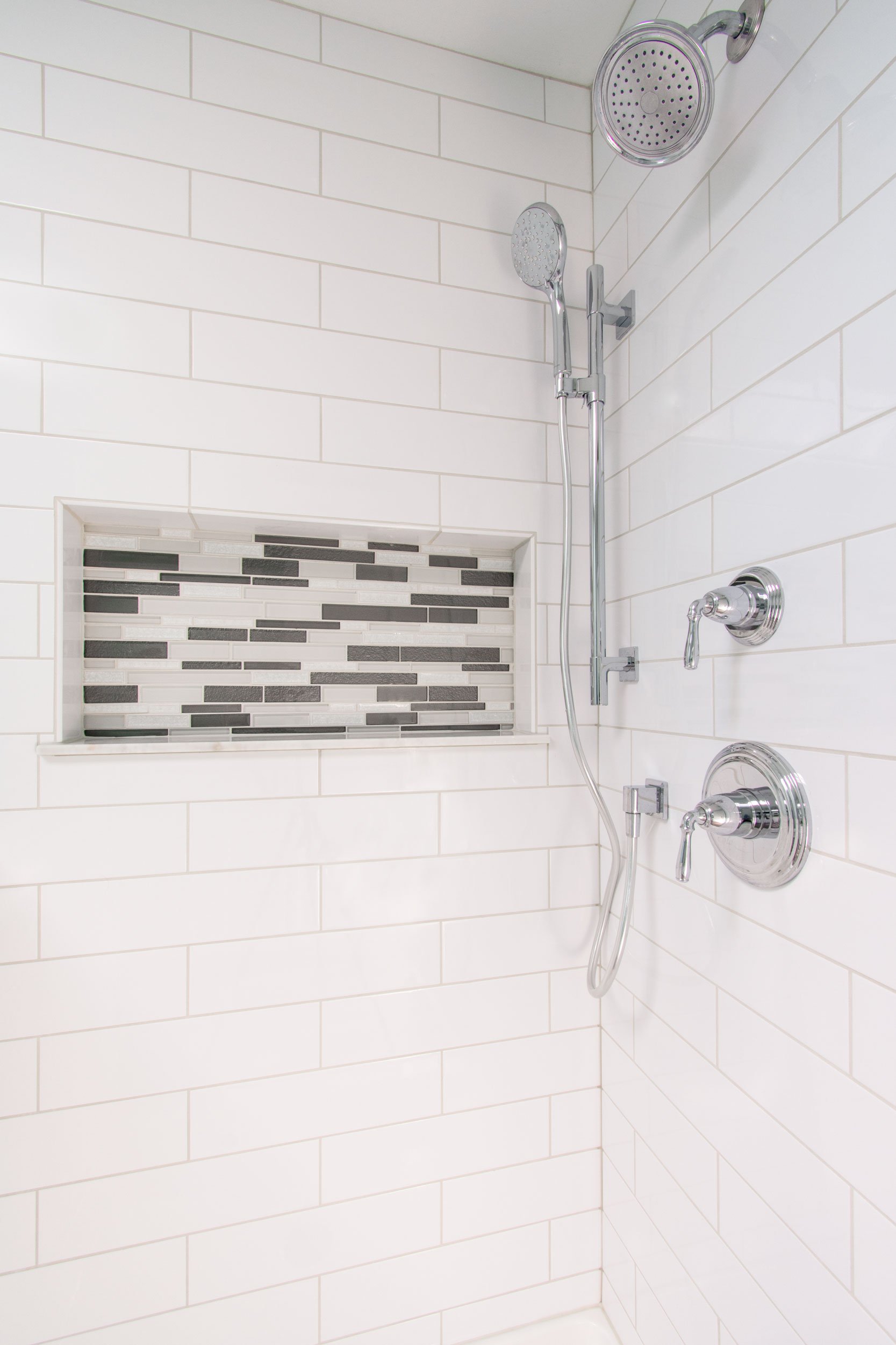 Bright and airy master bathroom with white subway tile