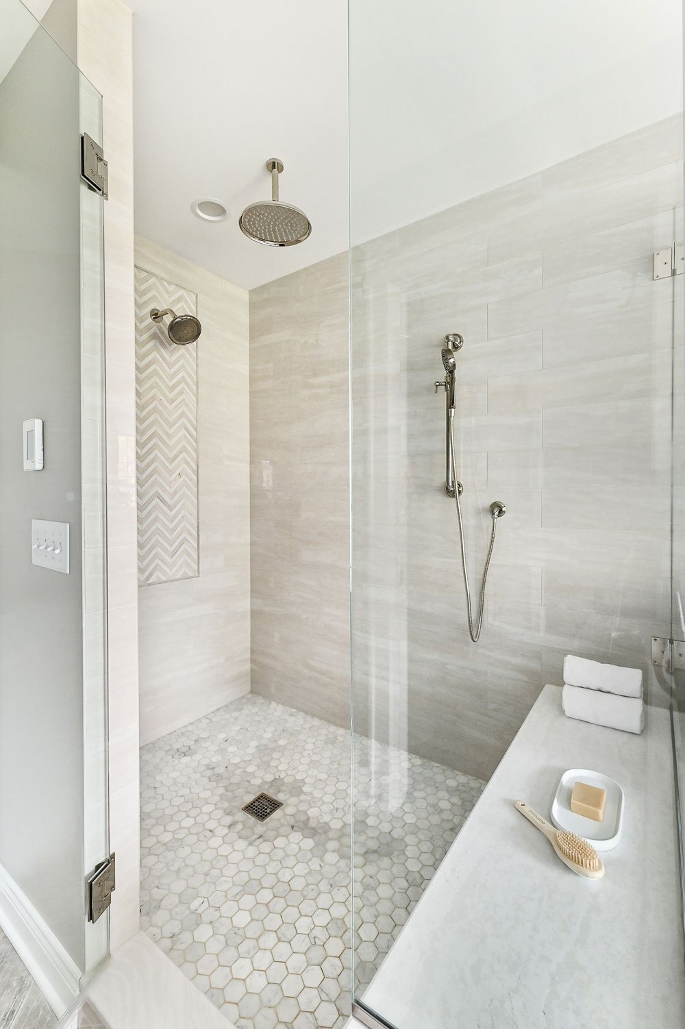walk-in tiled shower with rainhead