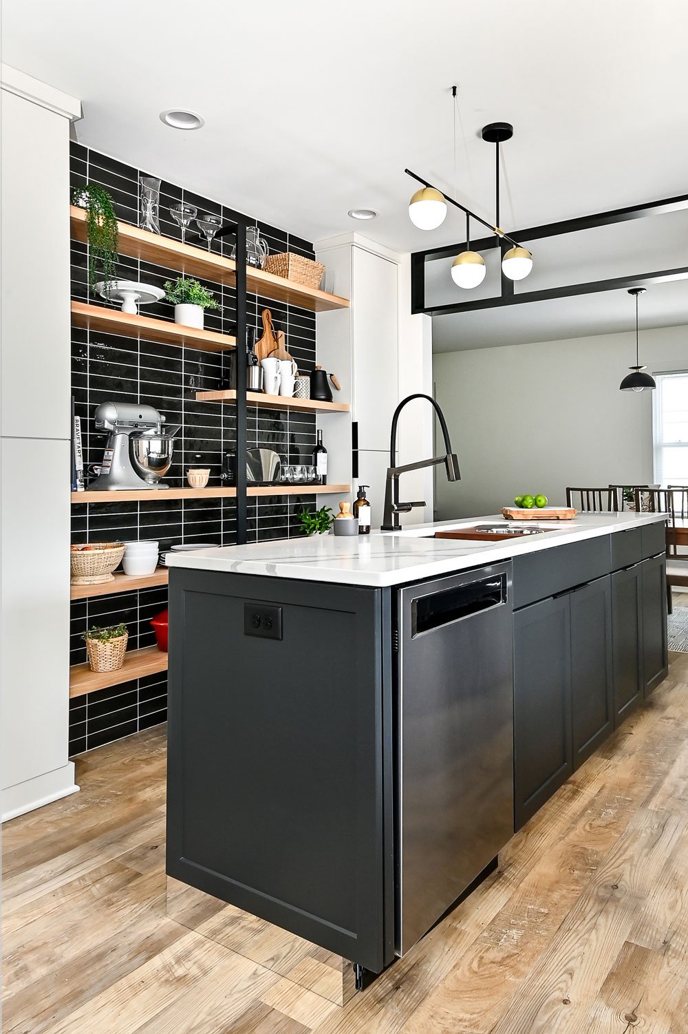 open shelving with black tile wall