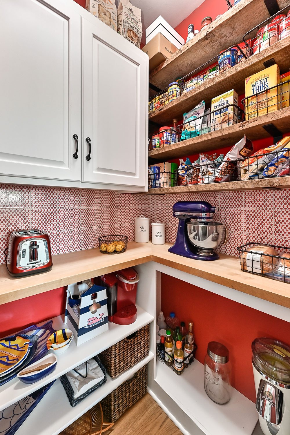 pantry with red tile backsplash